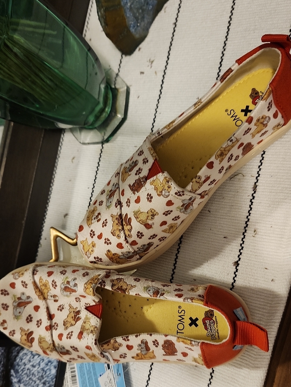 TOMS Cream Canvas Slip-Ons with Orange Accents and Puppy Print